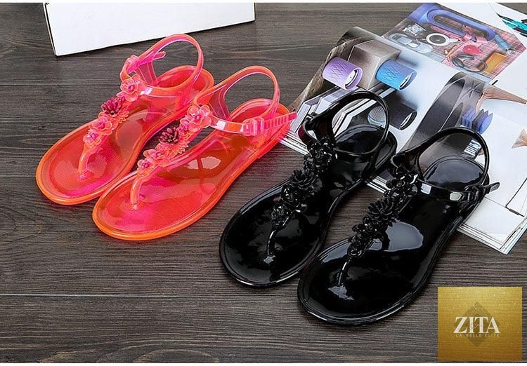 Stevvex women's summer flat sandals with T-strap design, floral pattern, breathable material, and non-slip soles for casual wear.