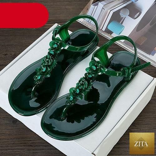 Stevvex women’s summer flip flops featuring T-strap design, floral pattern, breathable material, and non-slip flat soles for casual wear.