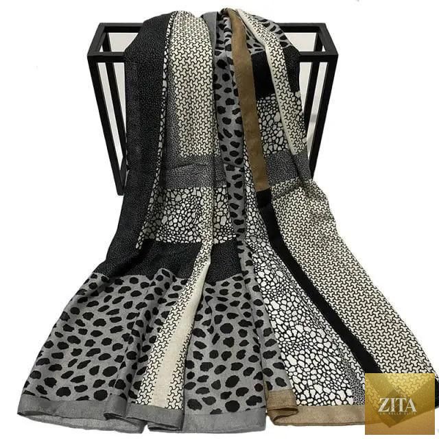 Women wearing a large leopard print cotton scarf with floral tassels, perfect for winter warmth and casual style.