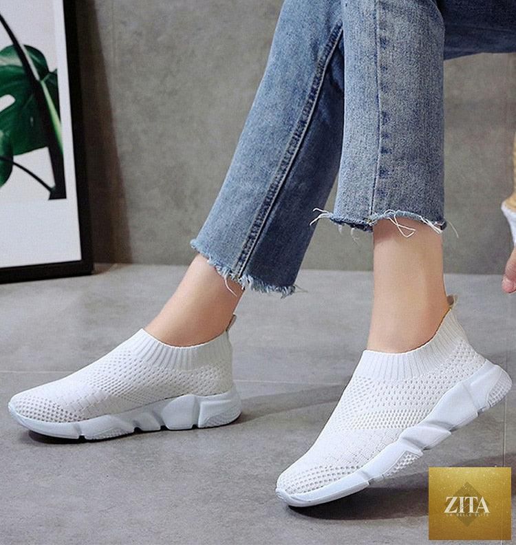 Women Stevvex slip-on white sneakers with breathable mesh, lightweight vulcanize shoes, ideal for casual walking and light sports.