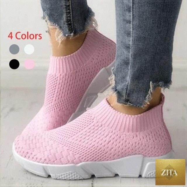 Women Stevvex slip-on white sneakers with breathable mesh, lightweight vulcanized shoes for casual walking and light workouts.