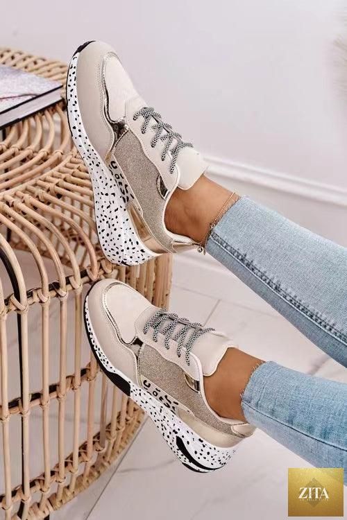 Stevvex women's leopard print sport running sneakers with lace-up design, breathable material, and height-increasing sole for walking and jogging.