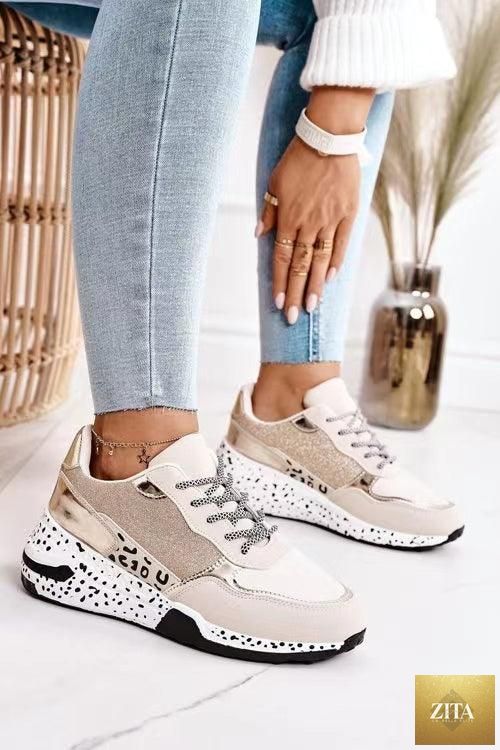 Stevvex women's leopard print sport running sneakers with lace-up design, breathable material, and height-increasing sole for walking and jogging.