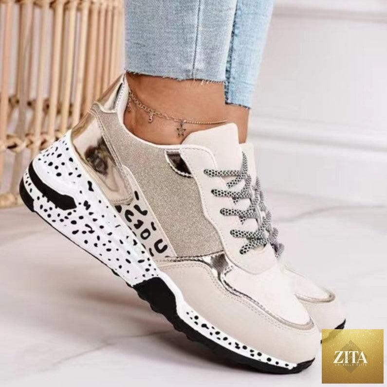 Women’s Stevvex leopard print sport running sneakers with lace-up design, breathable material, and height-increasing sole for walking and jogging.