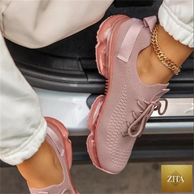 Women Stevvex trendy sneakers with cushion sole, lace-up design, breathable fabric, ideal for running and outdoor sports.