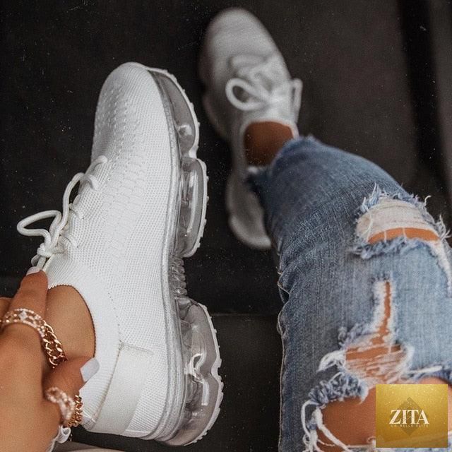 Women Stevvex trendy sneakers with cushion soles, lace-up design, breathable fabric, ideal for running and outdoor sports.