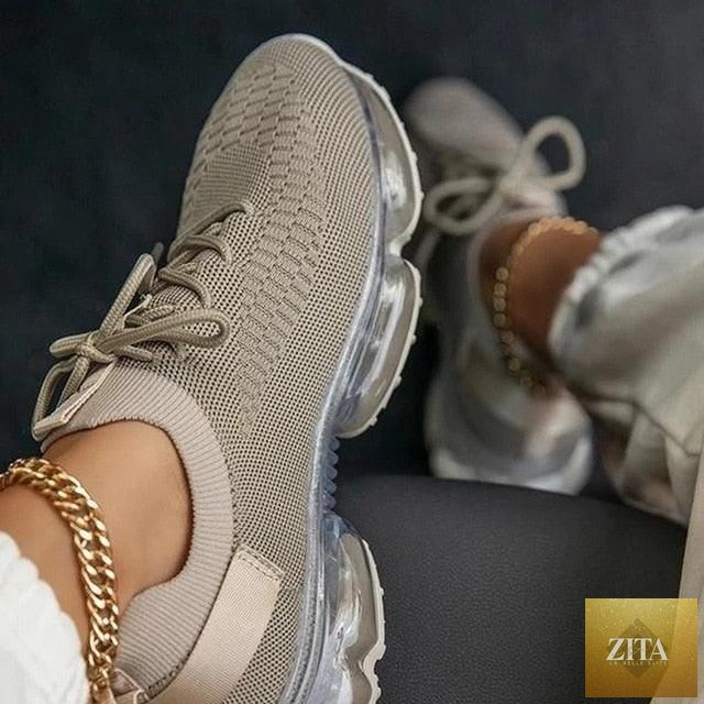 Women Stevvex trendy sneakers with cushion soles, lace-up design, breathable fabric, ideal for running and outdoor sports.