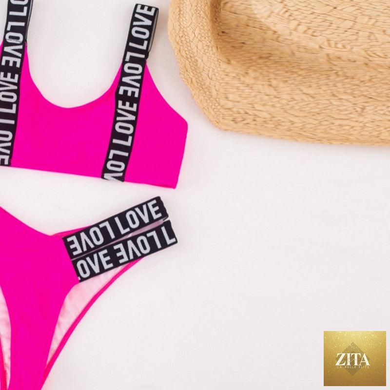Women’s two-piece push-up bikini with high waist, crisscross halter, letter print, and backless design, ideal for beach and swimwear fashion.