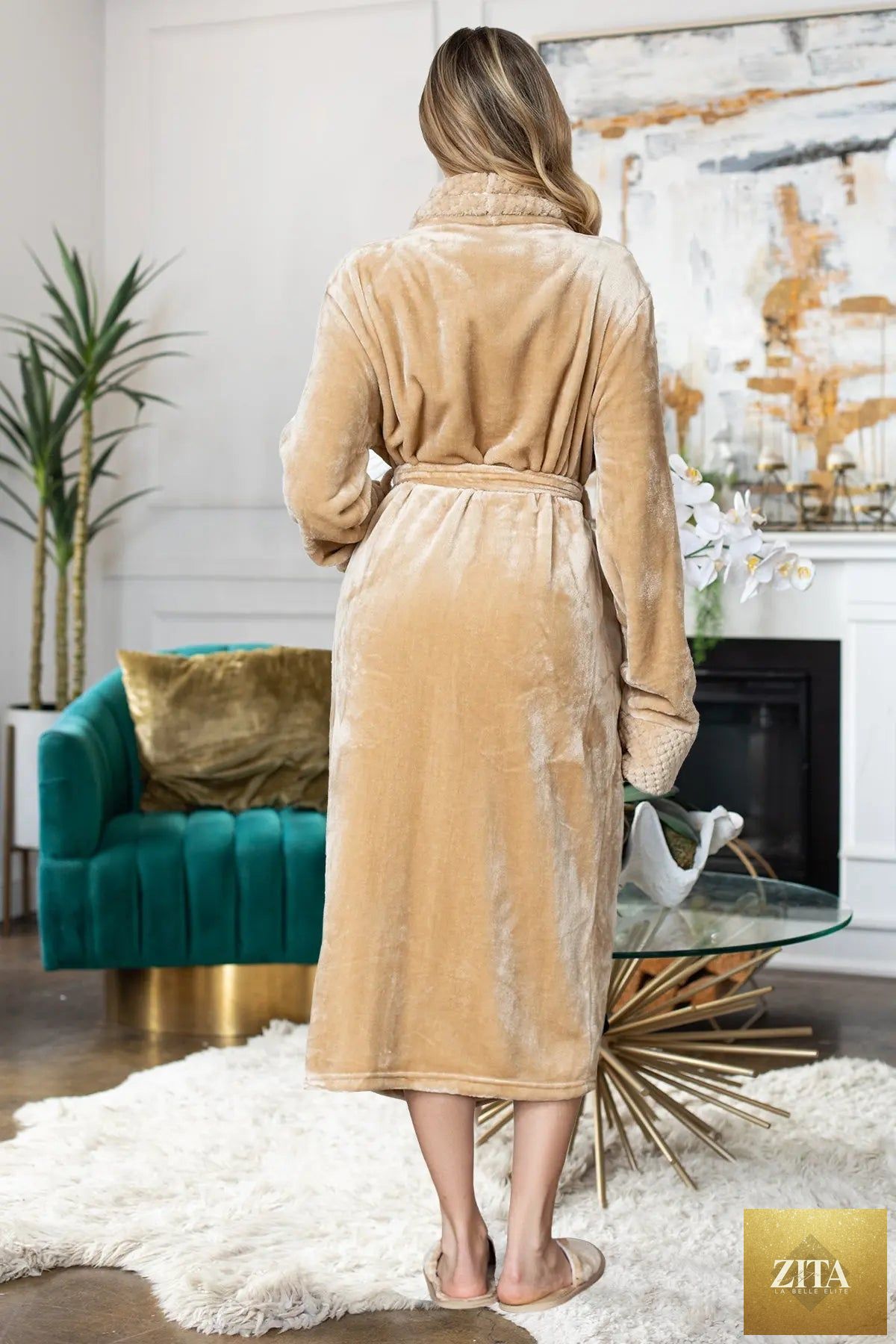 Women's ultra-soft plush bathrobe by Lotus Linen, showing the cozy, lightweight fabric and relaxed fit in a neutral color.