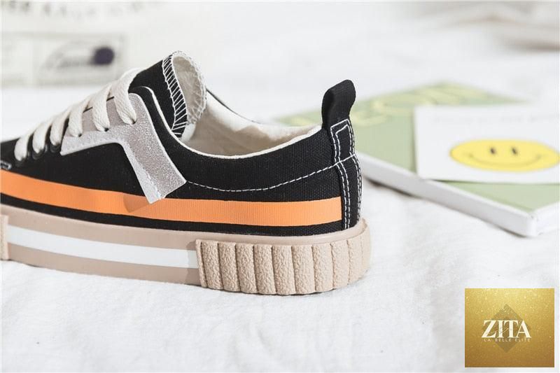Women's Spring fashion canvas flats by Stevvex featuring striped vulcanized design, slip-on style, low-cut trainers, and comfortable flat soles.