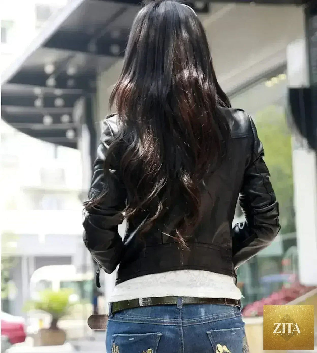 Black slim fit cropped vegan leather jacket by Femstylo, featuring a stylish design with a collar and zip closure.