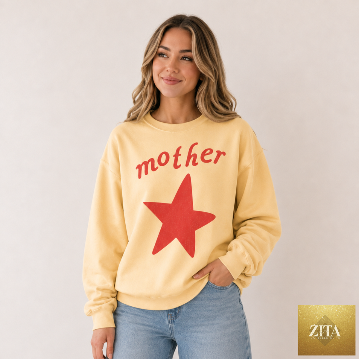 Yellow sweatshirt with a mother and star graphic, from Hey Jude Graphic Tees, featuring a vibrant design on soft fabric.