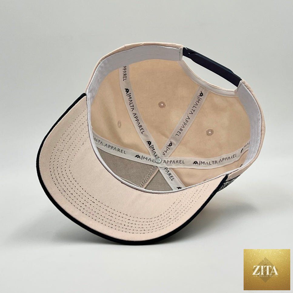 Malta Apparel 'YHWH' structured snapback hat in cream and baby blue with a curved brim and adjustable strap.