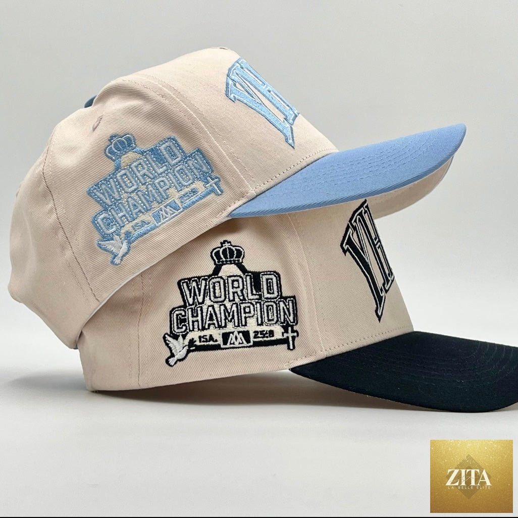 Cream and baby blue Malta Apparel YHWH structured snapback hat with front embroidery and adjustable strap.