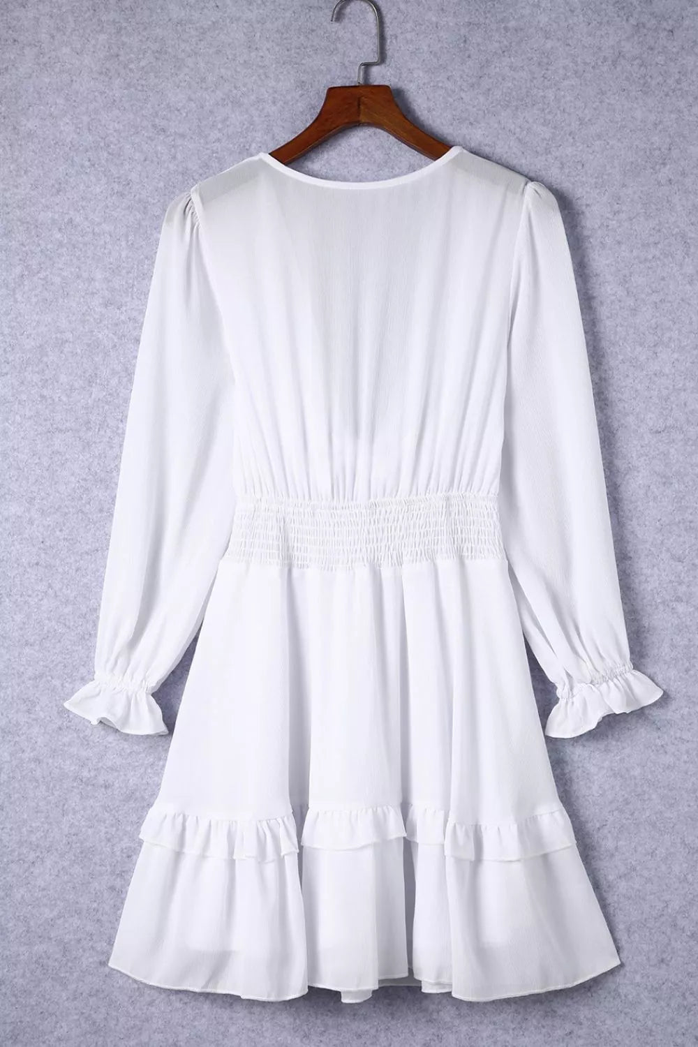 Elegant Shopiebay tie-front ruffle mini dress with smocked waist, featuring feminine ruffle details and a stylish silhouette.