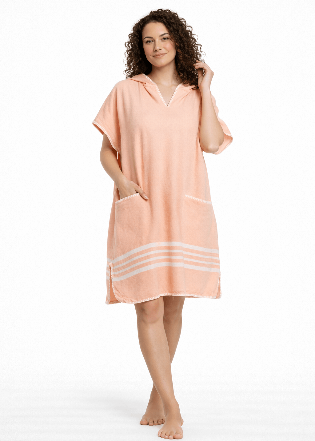 Bright melon-colored buldano beach cover-up poncho with hood, lightweight and casual for seaside wear.