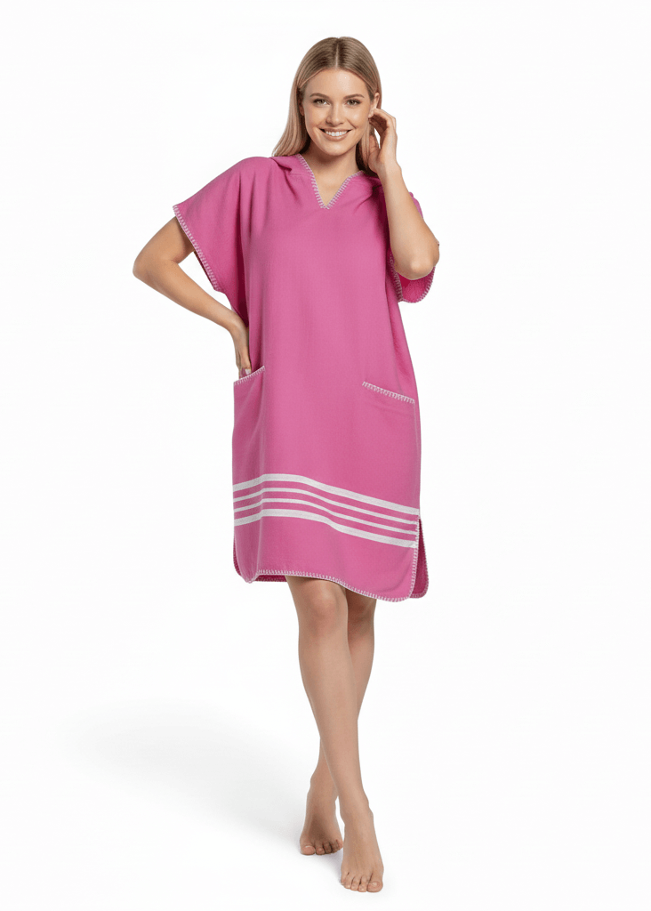 Bright fuchsia buldano beach cover-up poncho with hood, lightweight and casual for seaside outings.