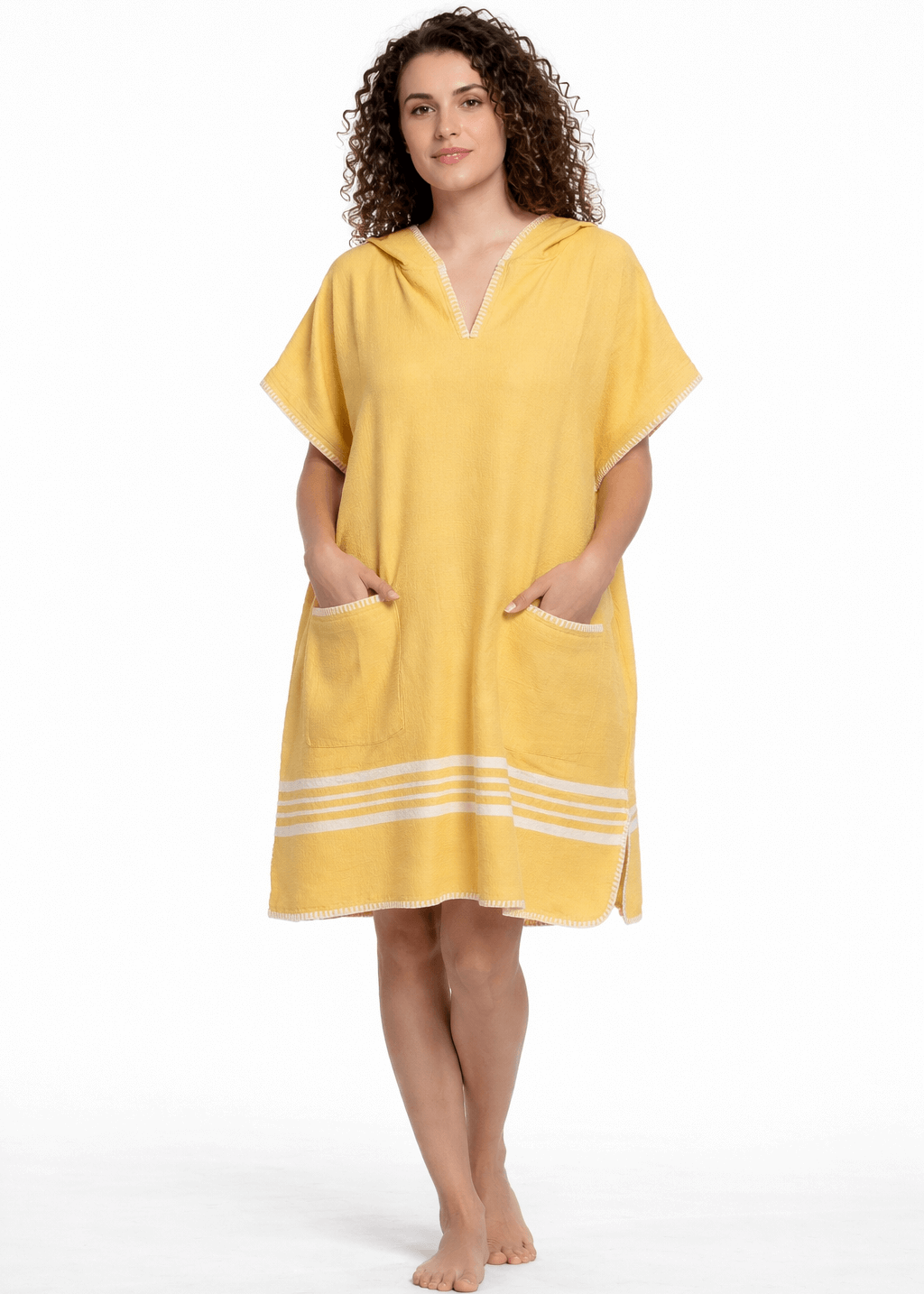 Yellow buldano beach cover-up poncho with hood, lightweight and casual for seaside wear, shown on a model.