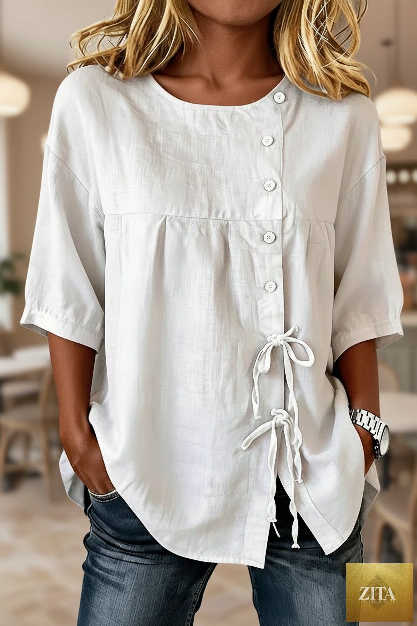 Women's lace-up button shirt from MERIDGE featuring a stylish top with a collar and long sleeves, displayed on a hanger.
