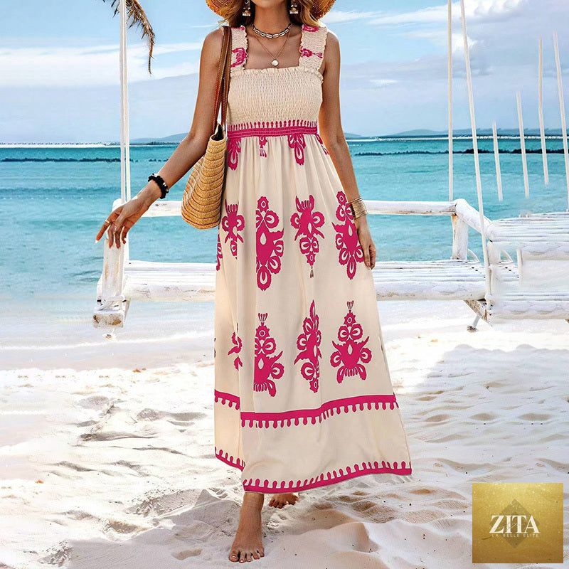 Women's printed maxi dress by MERIDGE with wide straps, smocked bodice, tassel waist, flowing fabric, perfect for summer wear.