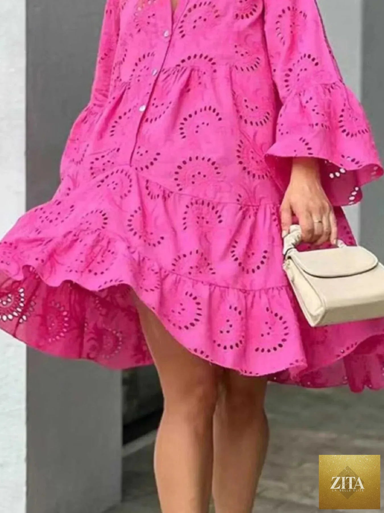 Eyelet ruffled hem tiered dress from Shopiebay featuring a feminine, layered design with eyelet detailing and ruffled accents.