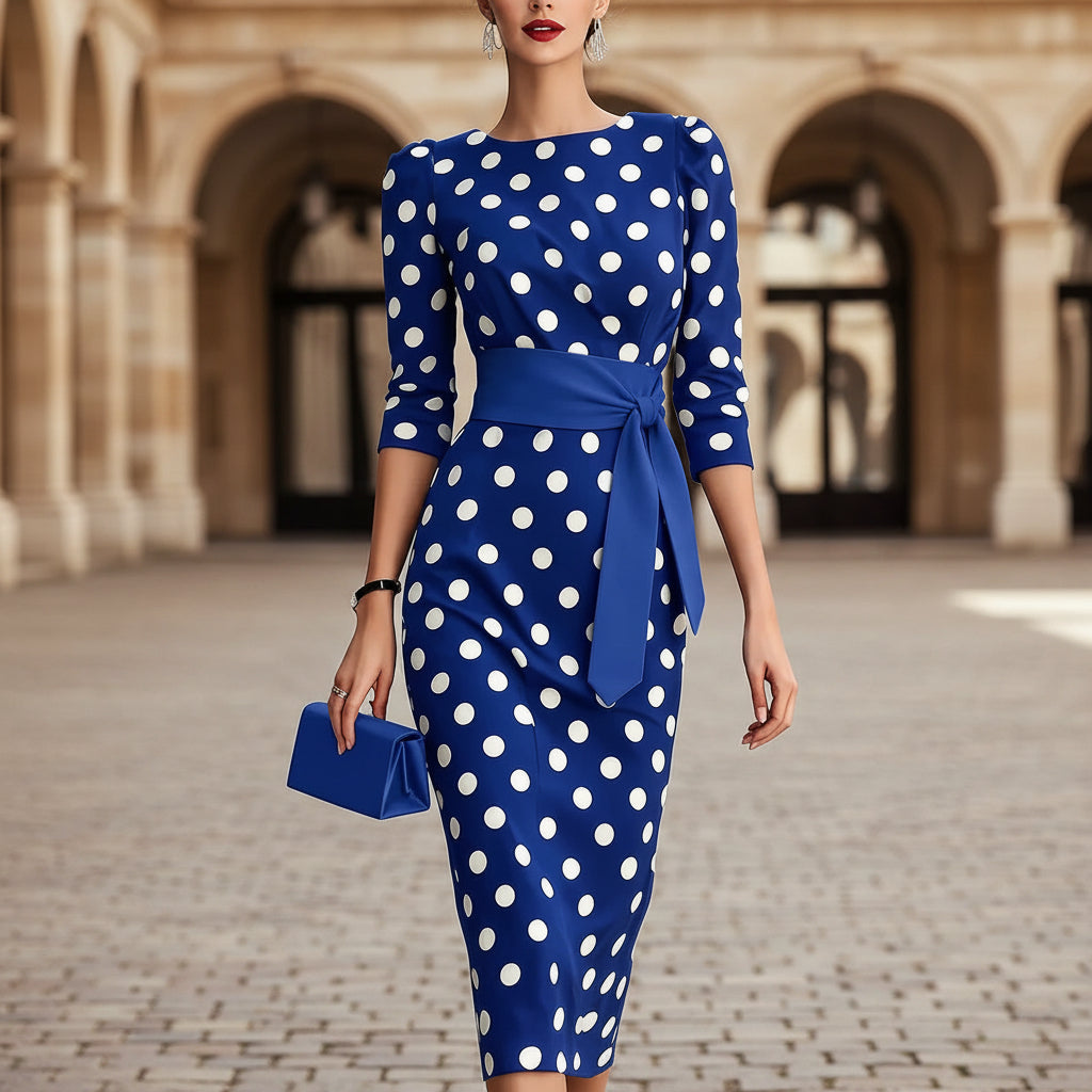 Women's retro polka-dot bodycon midi dress with belt and cross-tie detail, casualwear by FitiqueFit, shown on a model.