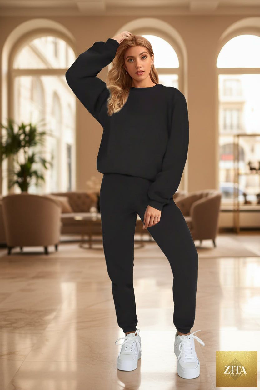 Women's oversized drop-shoulder sweatshirt and jogger pants sweatsuit set by MERIDGE, featuring a relaxed fit and casual style.
