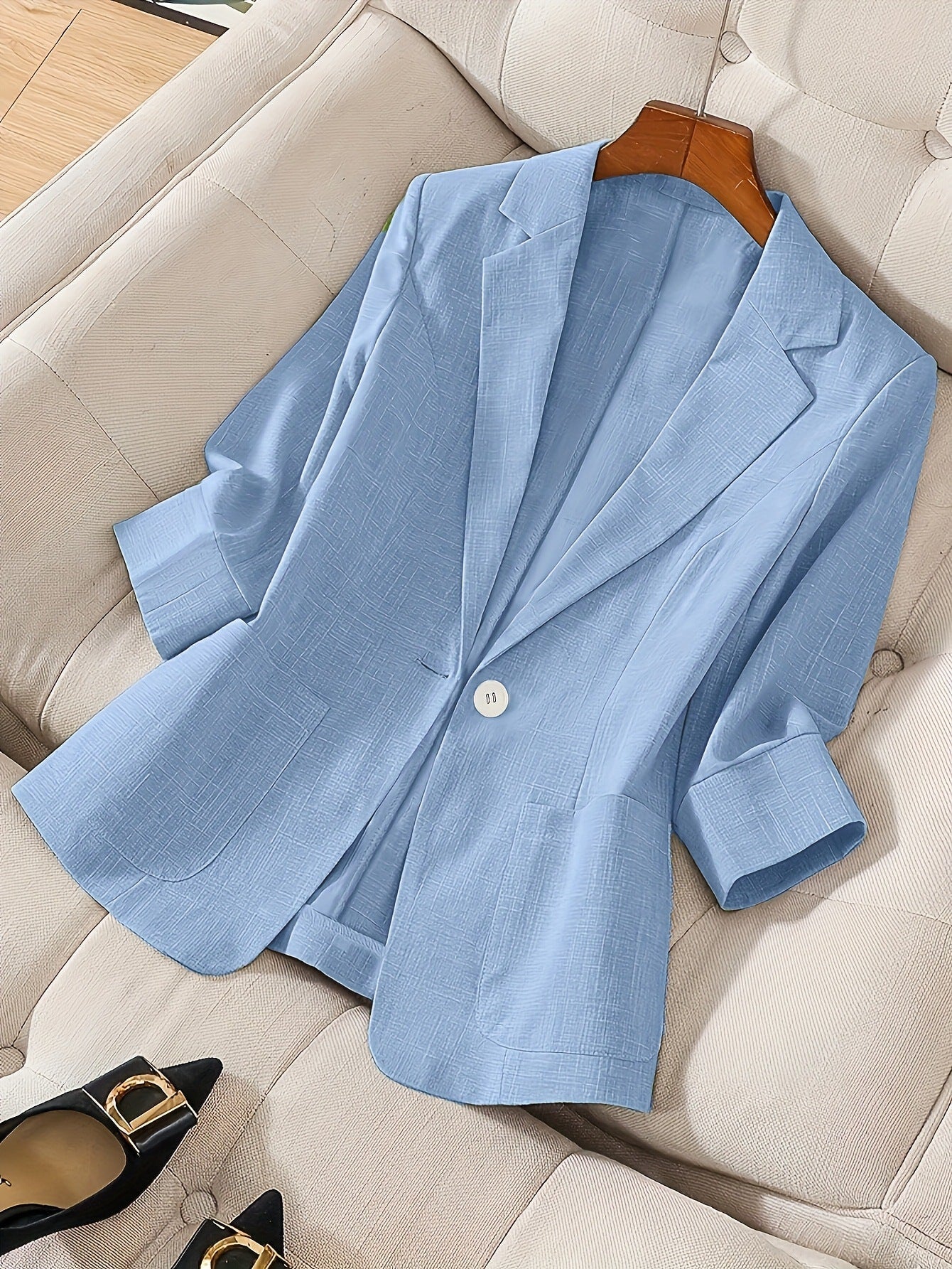 Women's casual blazer with three-quarter sleeves and single-button closure from FitiqueFit, displayed on a hanger.