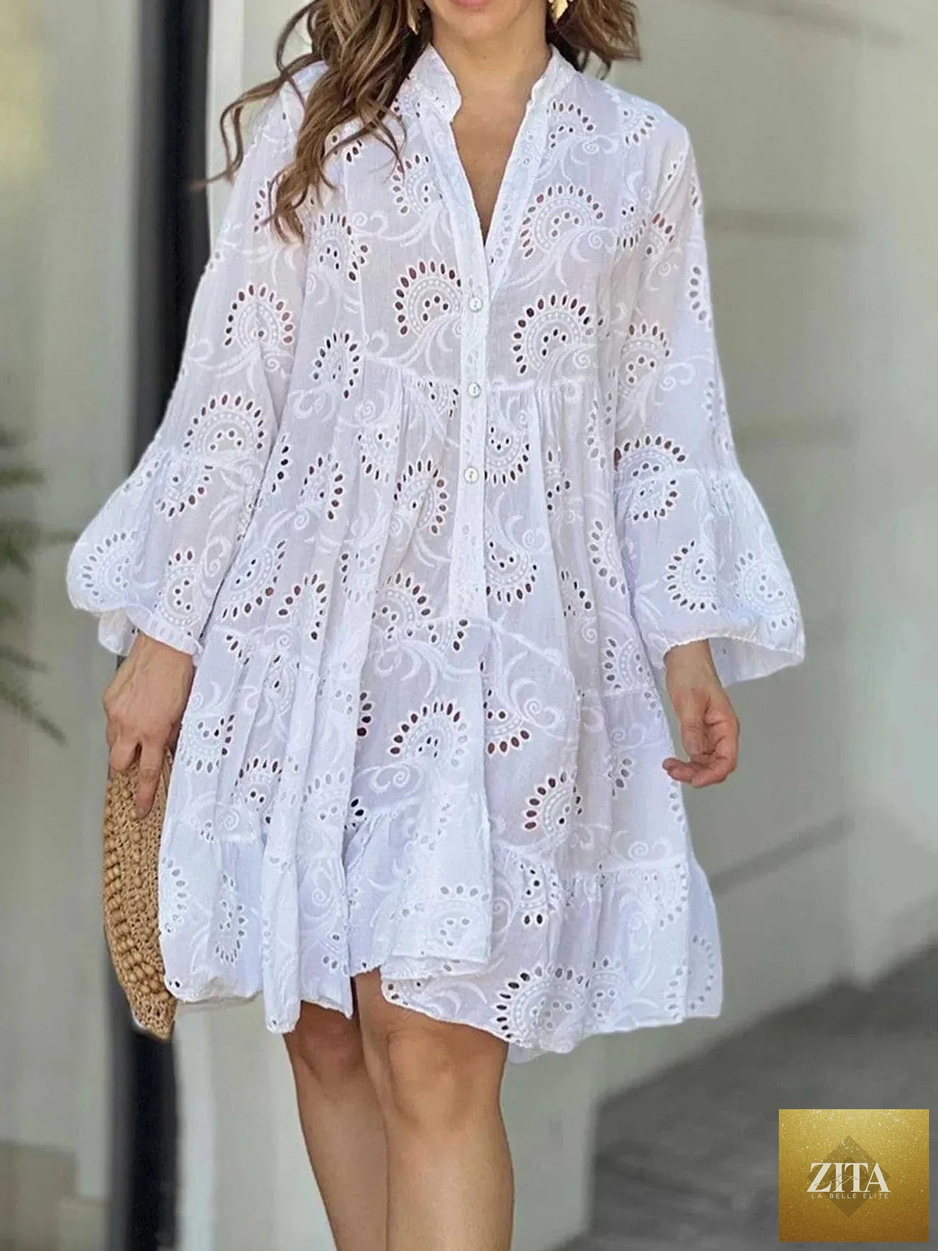 Eyelet ruffled hem tiered dress from Shopiebay featuring layered fabric and feminine ruffle details for casual or summer wear