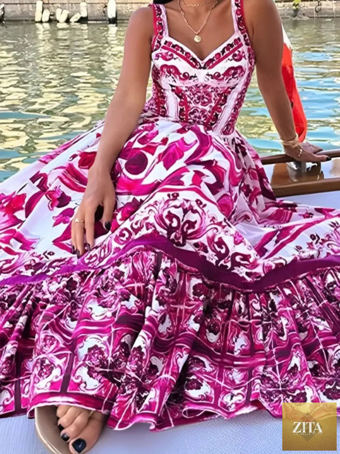 Smocked printed wide strap dress by Shopiebay featuring a flowy design and vibrant floral pattern, perfect for warm weather.