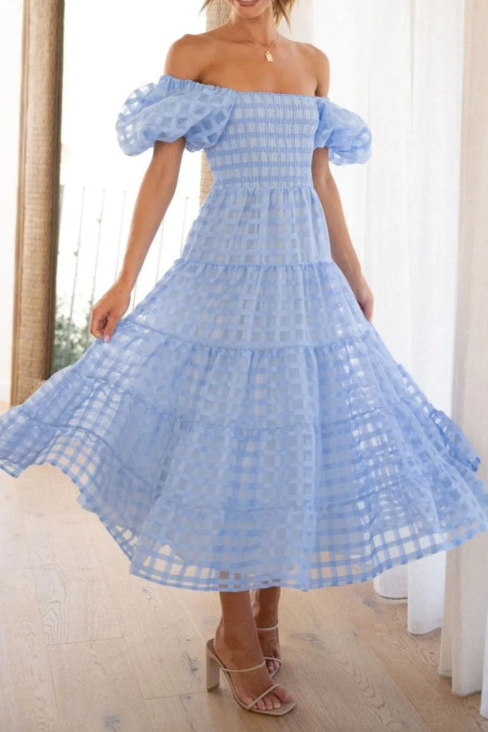 Off shoulder short puff sleeve midi dress from Shopiebay, featuring a stylish design with a fitted waist and flowing skirt.