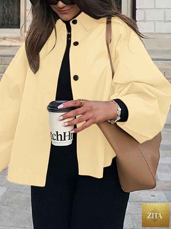 Women's French-style loose mid-length trench coat by FitiqueFit, featuring classic lapels and a belted waist in a neutral color.