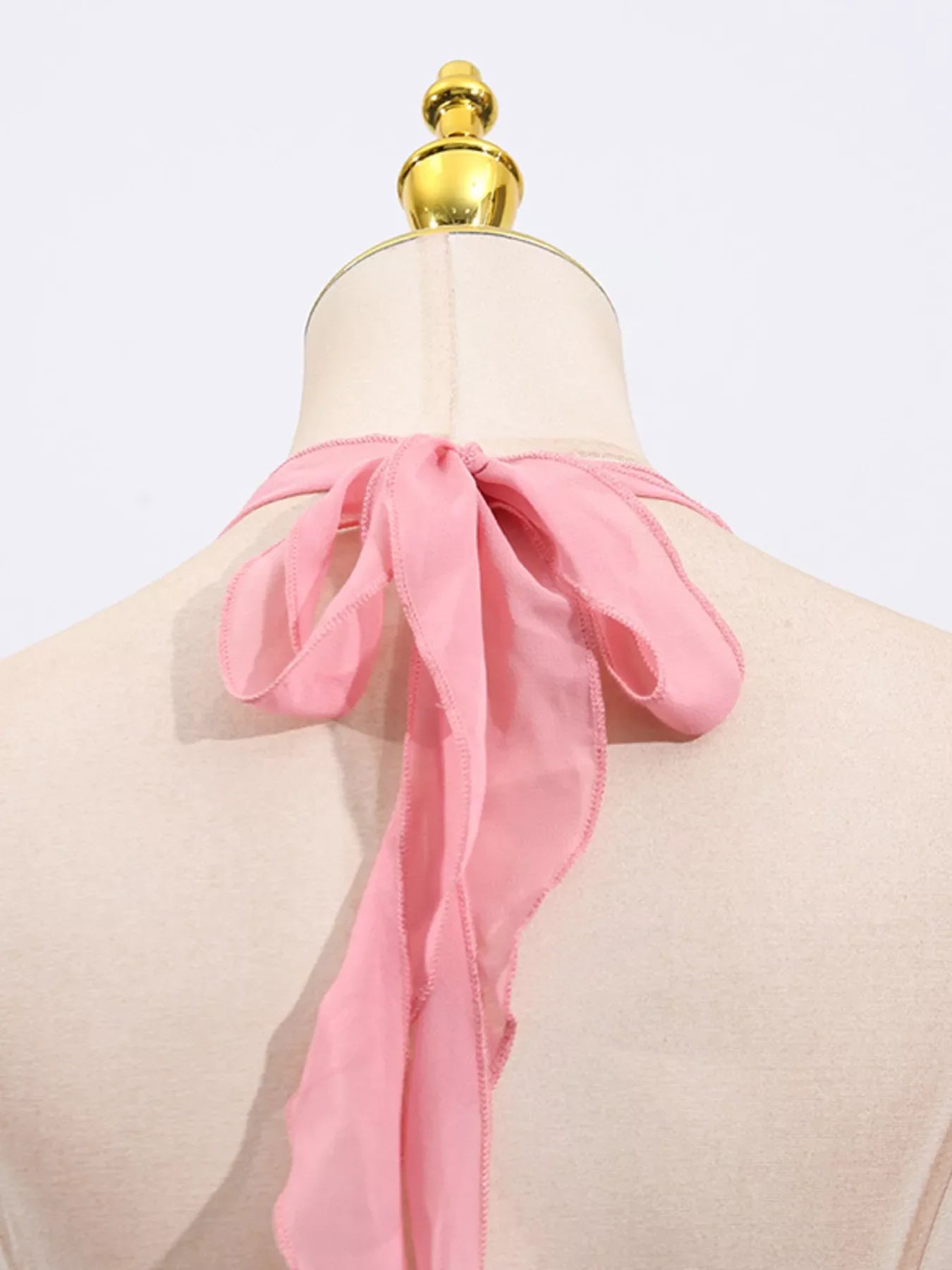 Sequin halter neck mini dress by Shopiebay featuring a shimmering design and sleeveless style, perfect for evening wear.