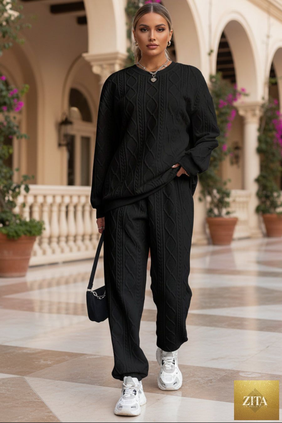 Women's cable-knit texture sweatshirt and jogger pants set by MERIDGE, featuring a cozy two-piece knit outfit.
