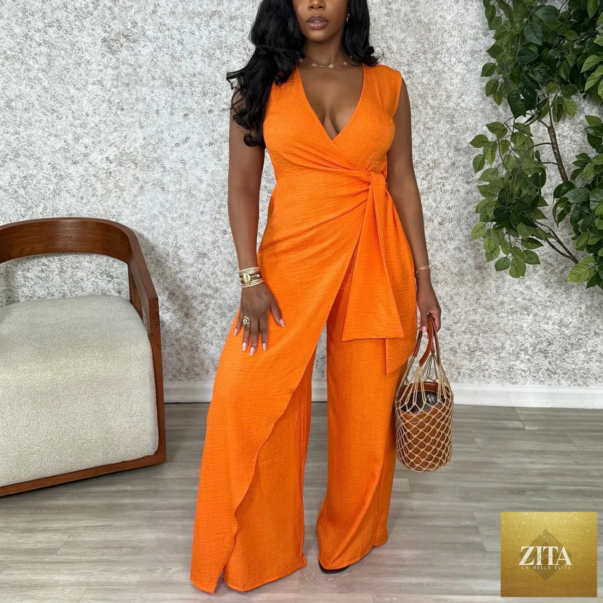Women’s sleeveless V-neck cross straps wide-leg office jumpsuit by Bella Mia, featuring a split front and stylish design.