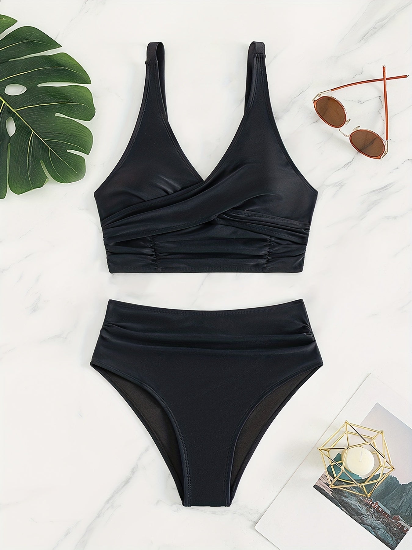 Solid black Stevvex bikini set with twist front, high waist, ruched tummy control, and cross strap detail for women’s beachwear.