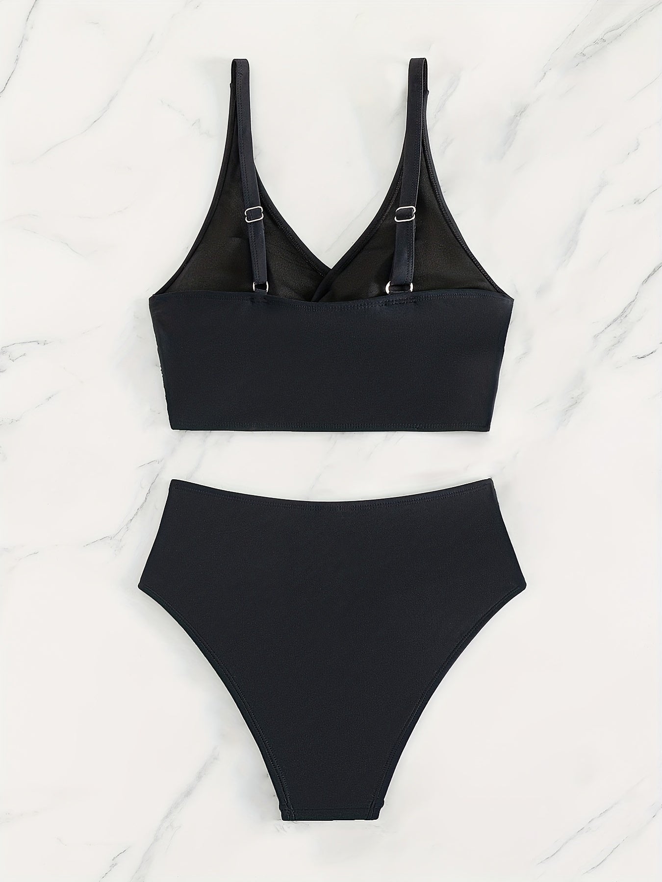 Black bikini solid high waist two-piece swimsuit with twist front and cross straps, featuring ruched tummy control and quick-dry polyamide fabric.