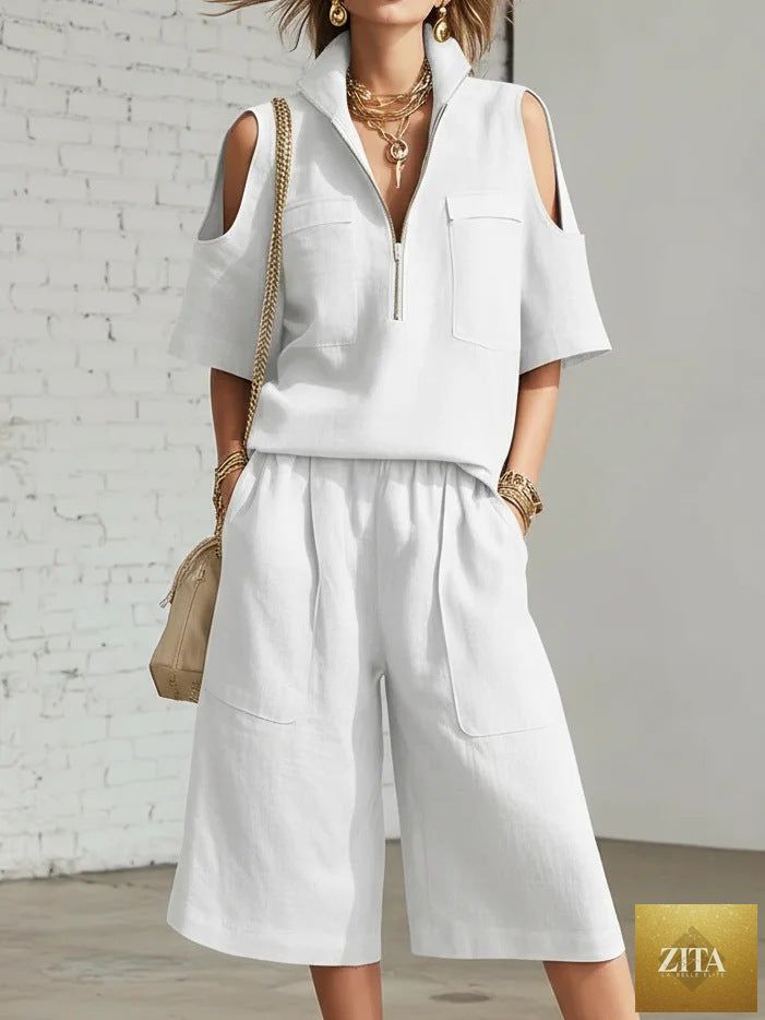 MERIDGE two-piece set with short-sleeve shirt and loose shorts, casual summer outfit, light fabric, displayed on a hanger.
