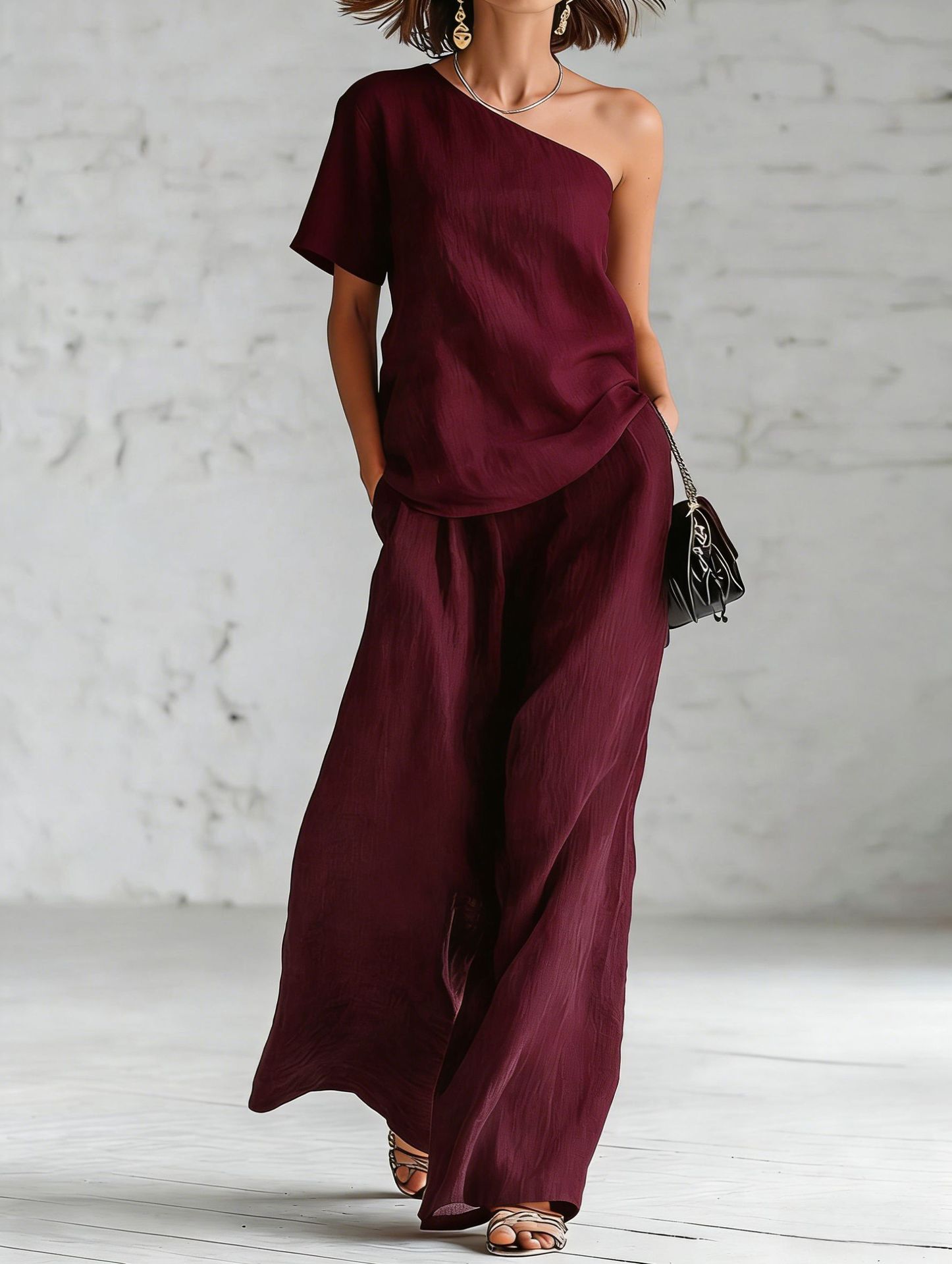 Women’s wide-leg pants and top set in casualwear style, featuring three-quarter sleeves and a relaxed fit from FitiqueFit.