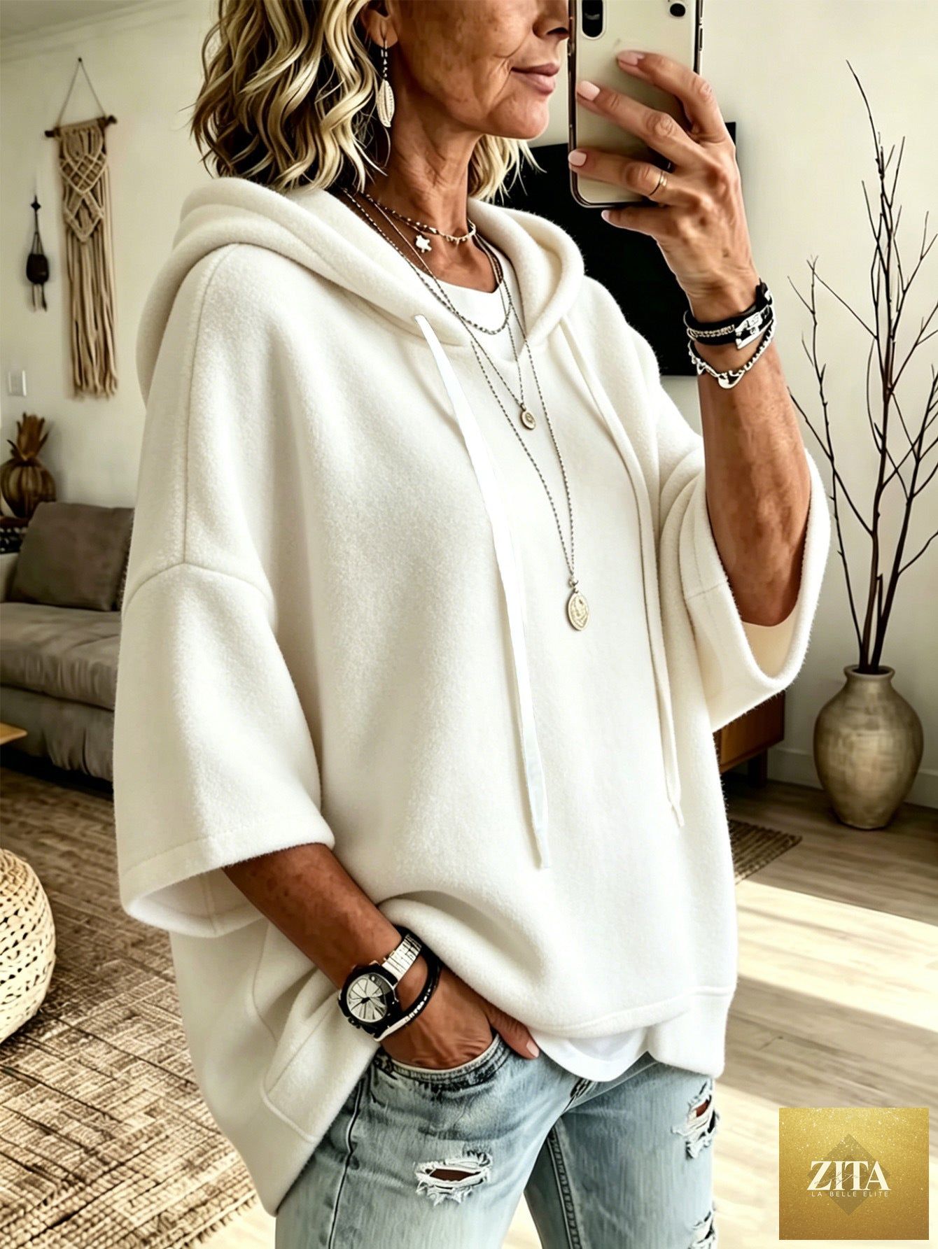 Women's oversized batwing sleeve hoodie by FitiqueFit, loose fleece pullover with relaxed fit and stylish draped sleeves.