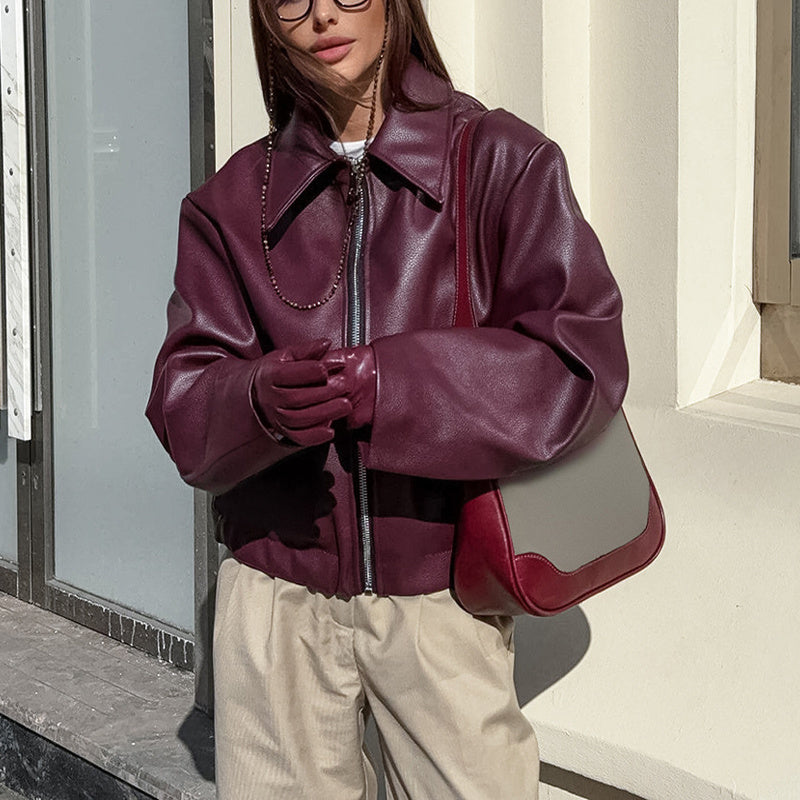 Vintage style women's solid color faux leather jacket by FitiqueFit, featuring classic design and sleek fit.