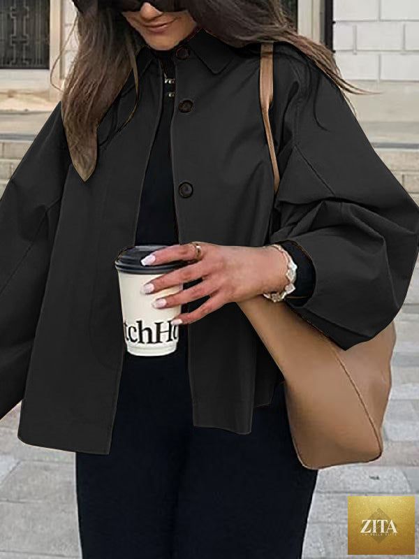 Women's French-style loose mid-length trench coat by FitiqueFit, showcasing classic double-breasted design and neutral beige color.