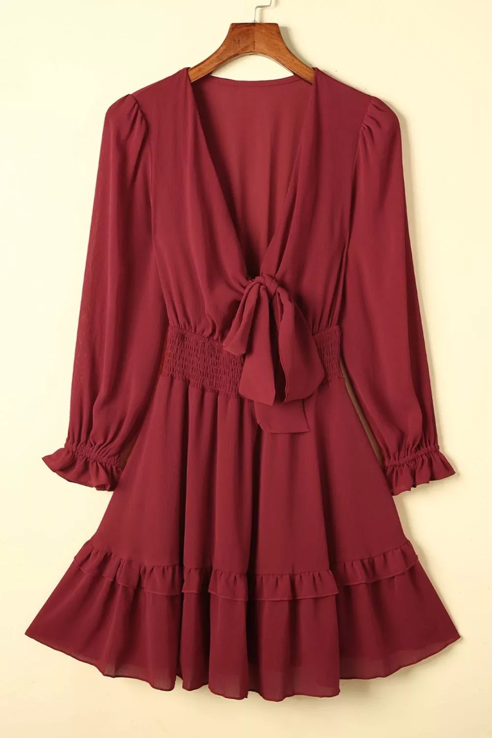 Elegant tie-front ruffle mini dress with smocked waist by Shopiebay, featuring a stylish, feminine design and lightweight fabric.