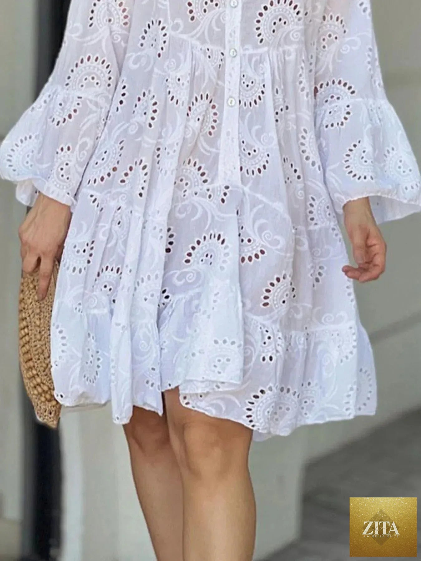 Eyelet ruffled hem tiered dress by Shopiebay featuring a flowy, layered design with eyelet details and ruffled accents.