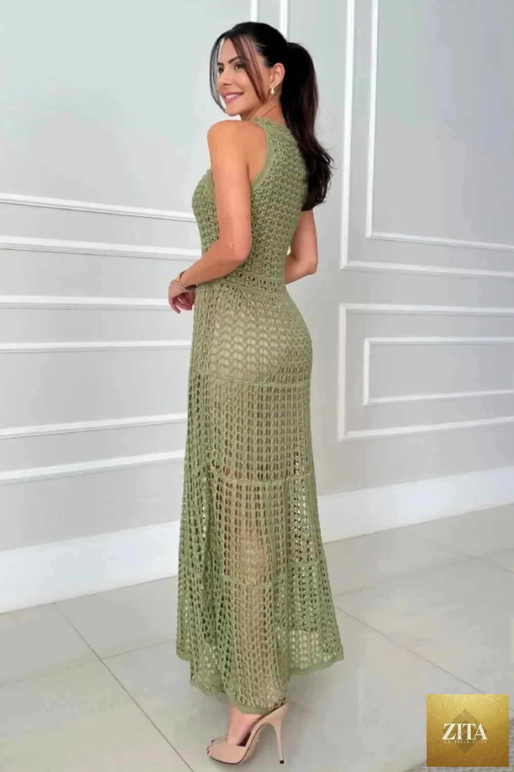 Hollowed-out sleeveless maxi dress by Shopiebay featuring a flowy design and stylish cut-out details, perfect for summer wear.