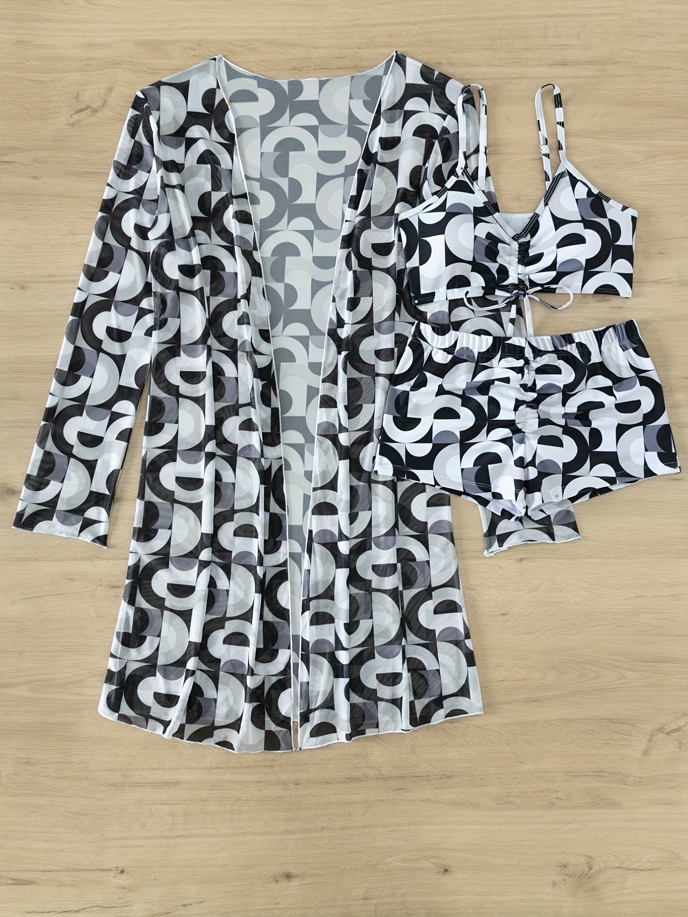 Stevvex Modern Geo 3-Piece bikini set with vibrant geometric print, V-neck top, boxer shorts bottoms, and long sleeve cover shirt.