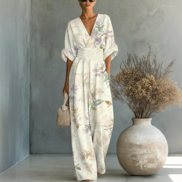 Women's waist-cinched V-neck printed wide-leg jumpsuit by FitiqueFit, featuring a casual fit with a stylish and comfortable design.