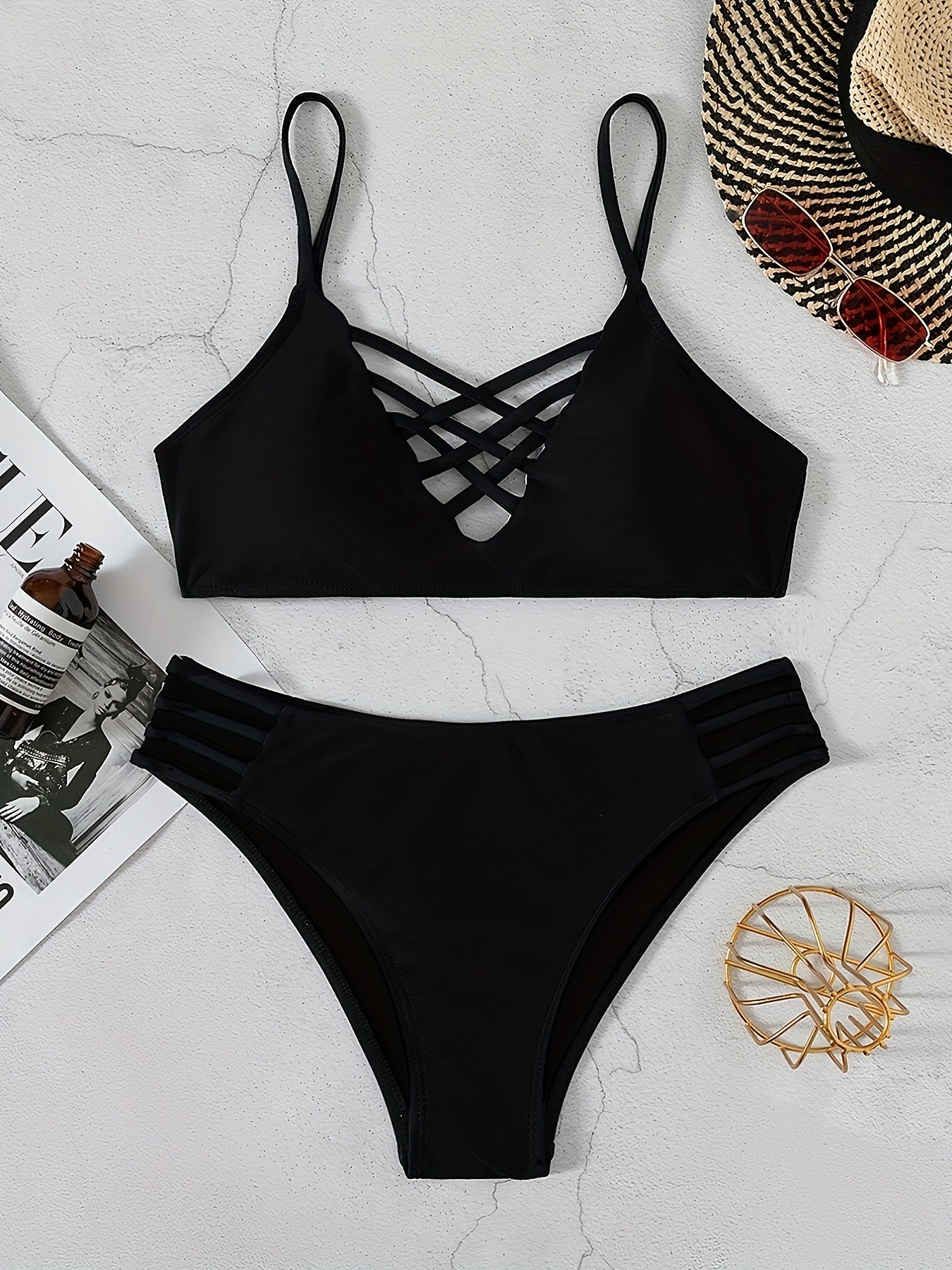 Stevvex Noir Allure criss cross bikini set with hollow out design, high waist buckle, adjustable straps, and medium stretch nylon.