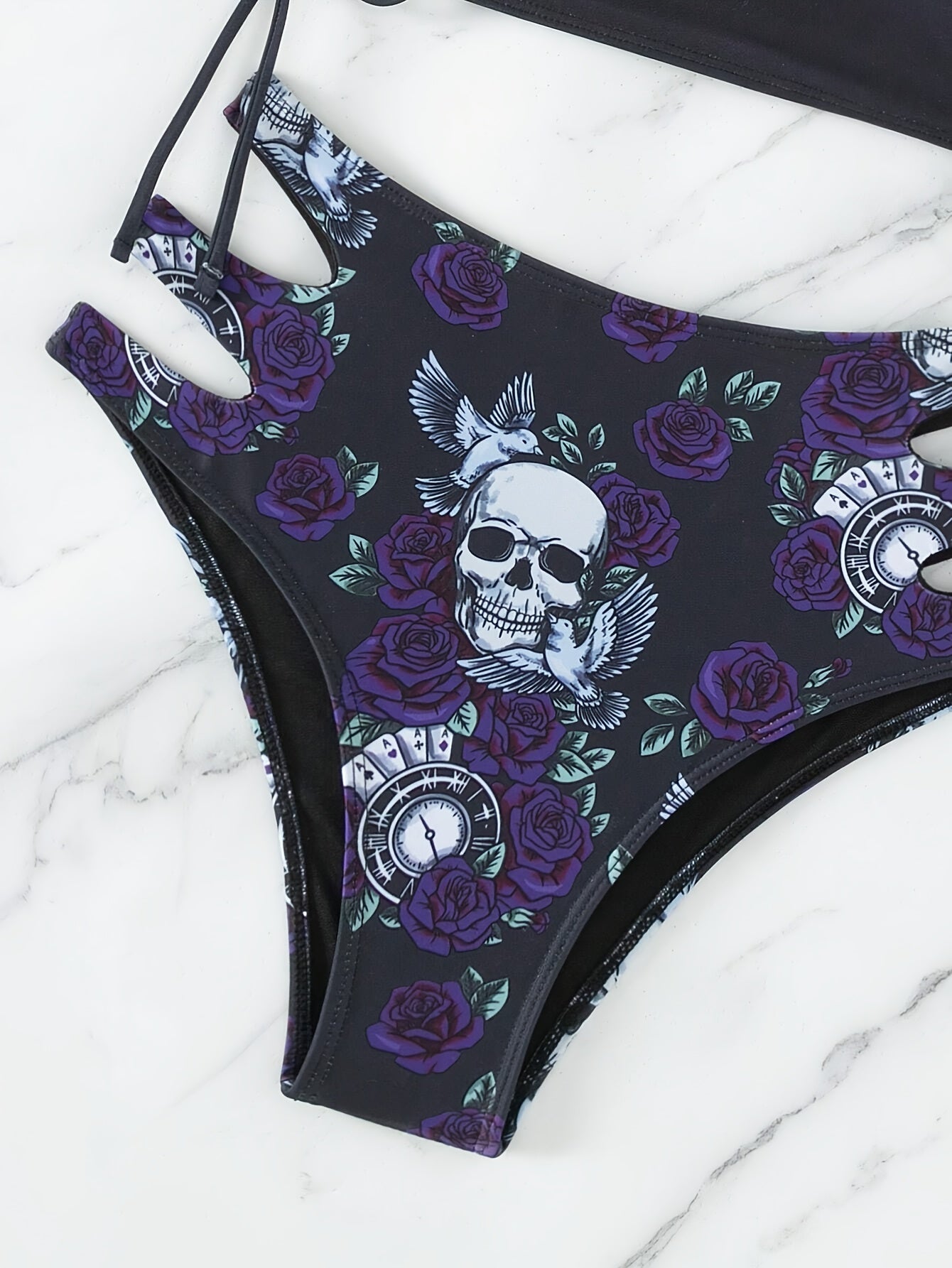 Stevvex skull print bikini set featuring lace-up floral design, hollow-out style, crew neck, perfect for beach, festival, summer.
