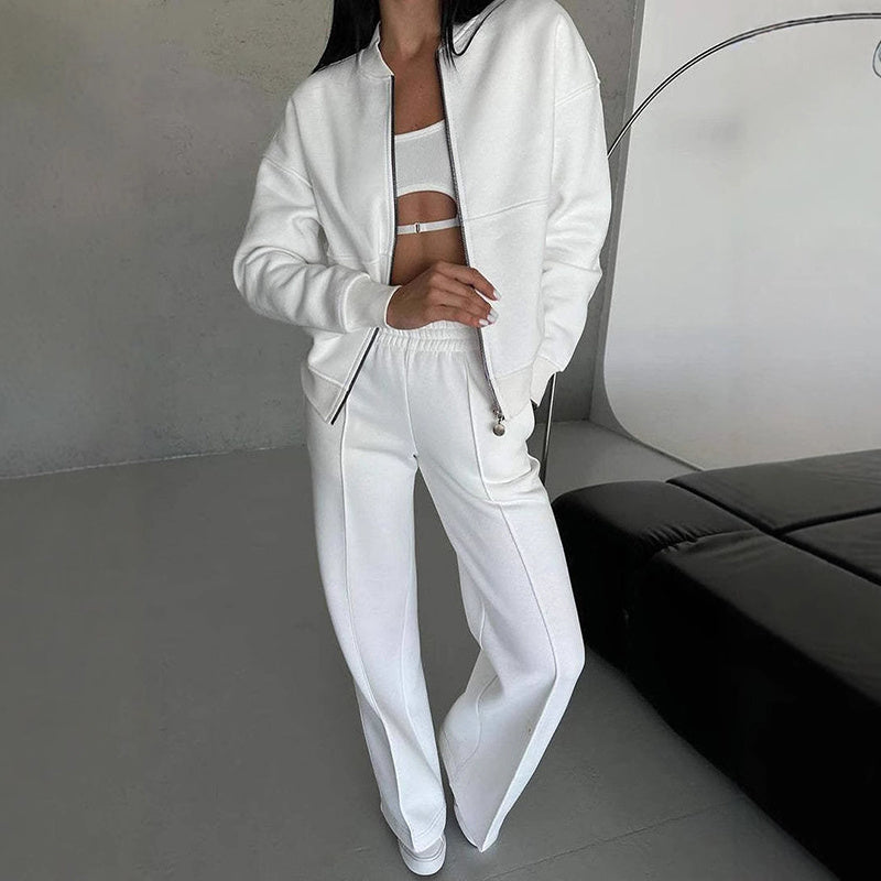 Women’s casual zip-up sweatsuit set by FitiqueFit with a jacket and wide-leg sweatpants, shown in a relaxed, comfortable fit.